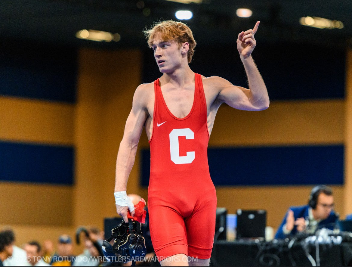 Wrestler signaling number one after a match